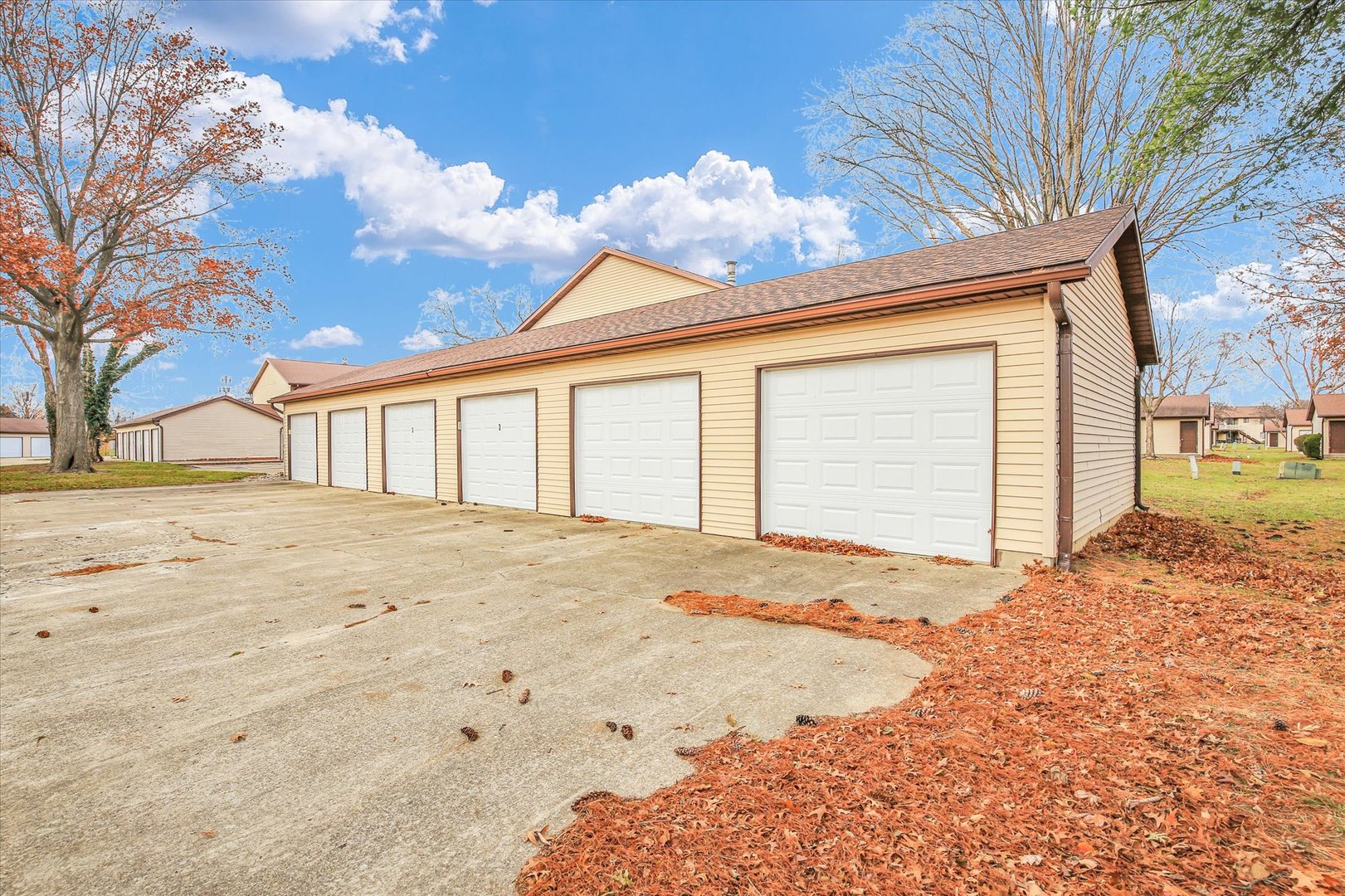 1802 Beck Drive, Unit 7 Urbana, IL 61802 - Photo 25 of 26 a view of garage with large tree