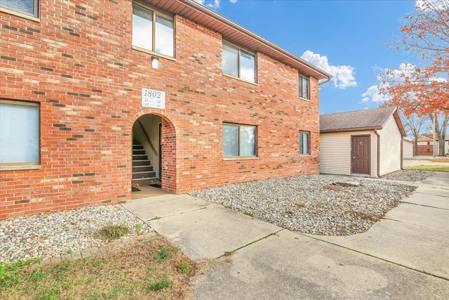 a front view of a house with mountain