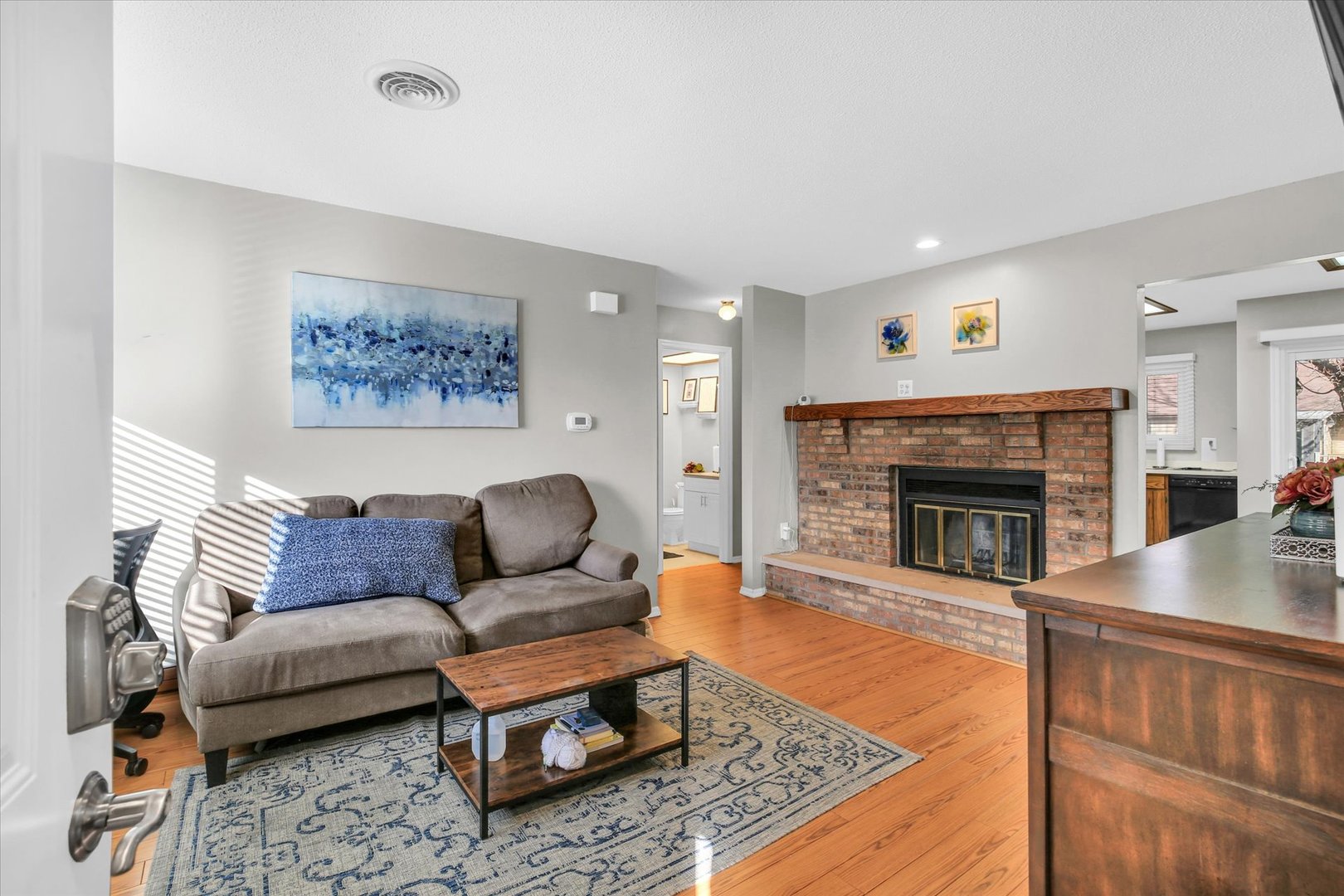 1802 Beck Drive, Unit 7 Urbana, IL 61802 - Photo 4 of 26 a living room with furniture and a fireplace