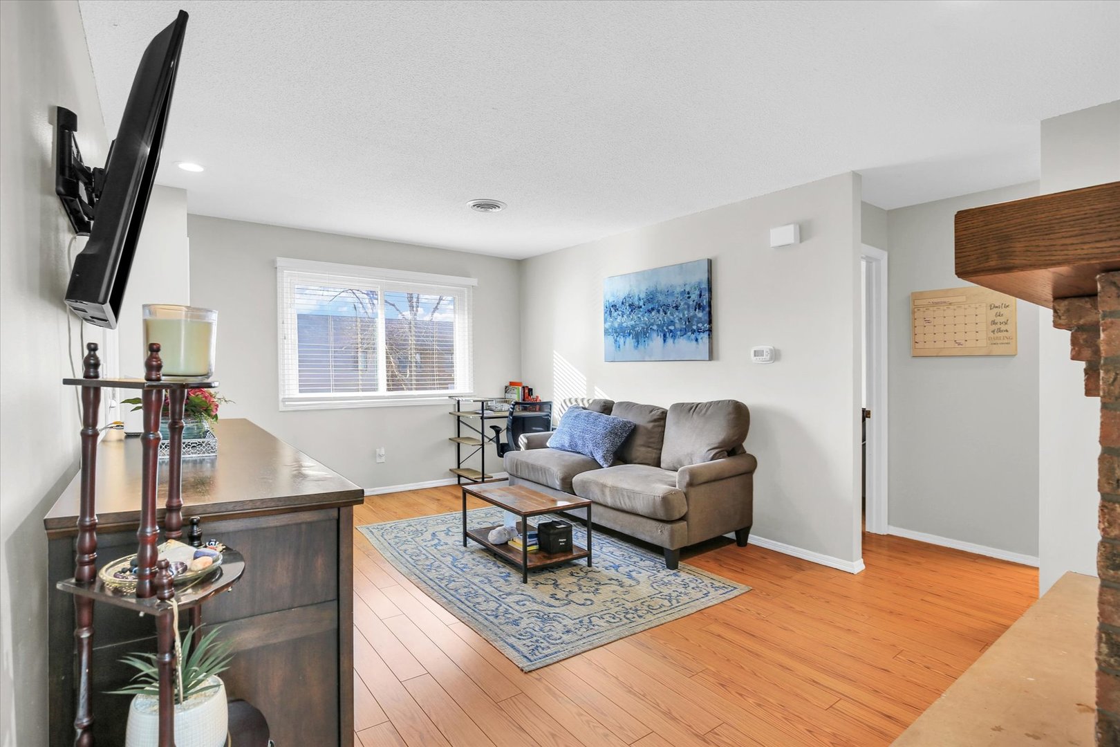 1802 Beck Drive, Unit 7 Urbana, IL 61802 - Photo 6 of 26 a living room with furniture and a flat screen tv