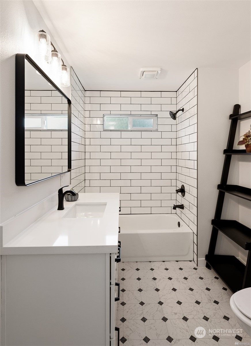 408 Nelson Street Sedro-Woolley, WA 98284 - Photo 13 of 25 a bathroom with a sink a bathtub and a shower