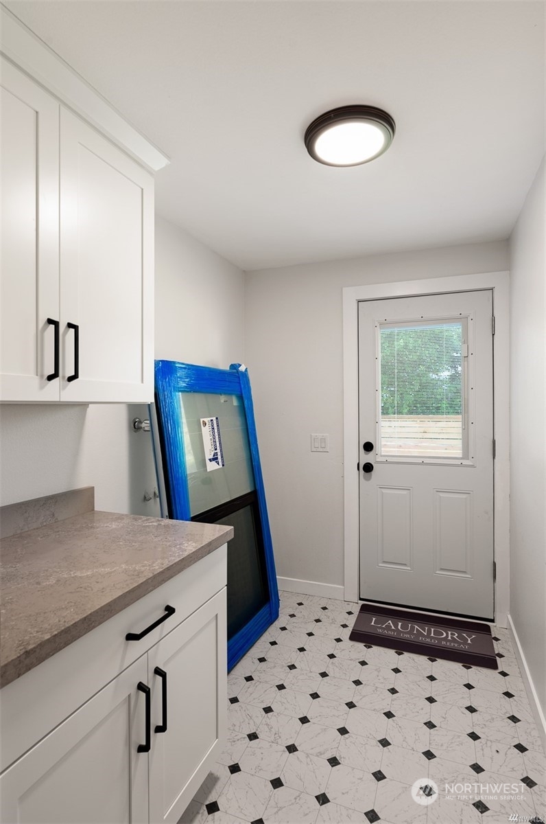 408 Nelson Street Sedro-Woolley, WA 98284 - Photo 14 of 25 a view of a hallway with front door and wooden floor