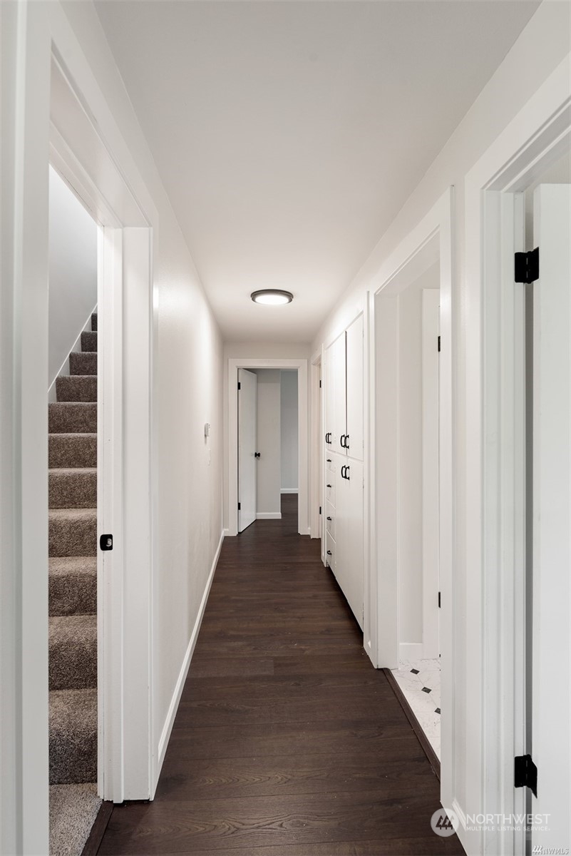 408 Nelson Street Sedro-Woolley, WA 98284 - Photo 16 of 25 a view of a hallway with wooden floor and entryway
