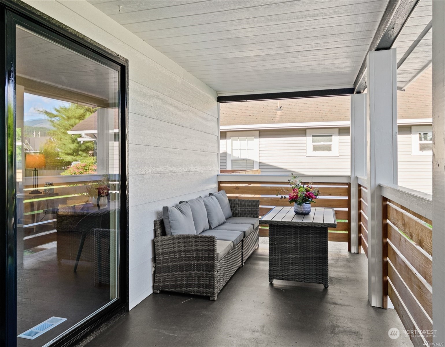 408 Nelson Street Sedro-Woolley, WA 98284 - Photo 21 of 25 a living room with furniture and a floor to ceiling window