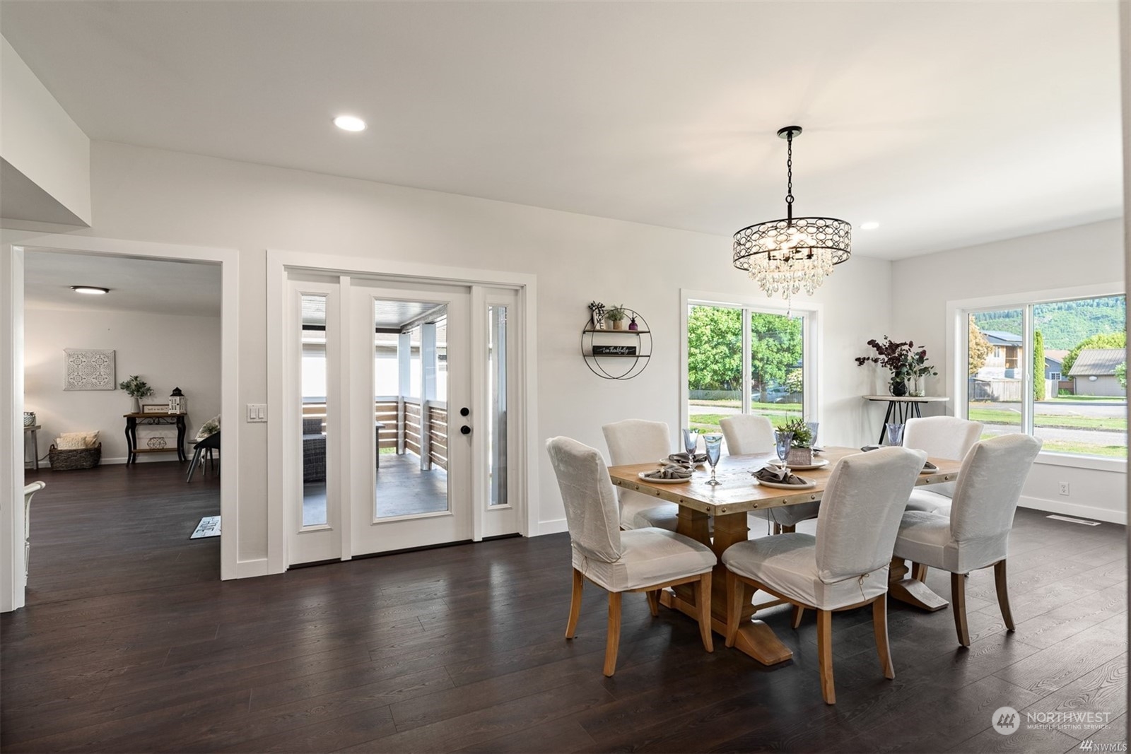 408 Nelson Street Sedro-Woolley, WA 98284 - Photo 3 of 25 a view of a dining room with furniture window and wooden floor