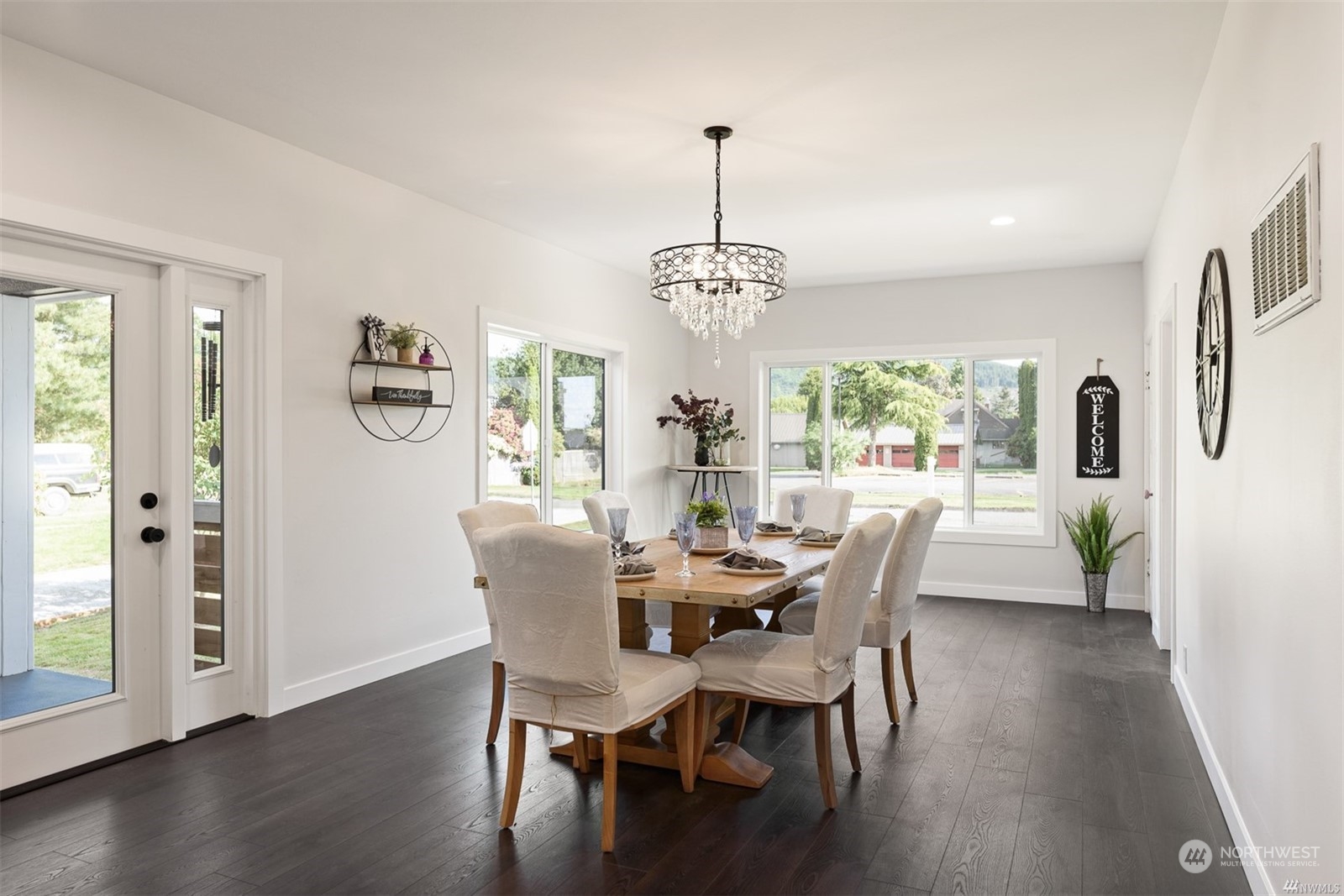 408 Nelson Street Sedro-Woolley, WA 98284 - Photo 4 of 25 a view of a dining room with furniture window and wooden floor