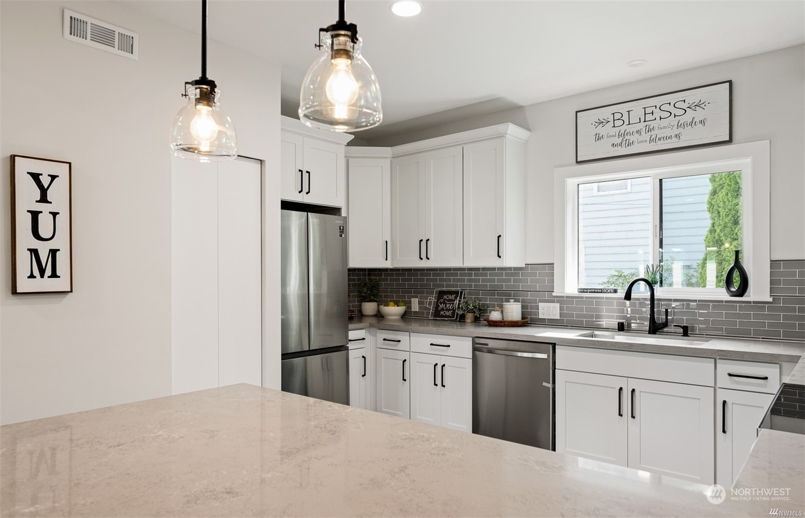 408 Nelson Street Sedro-Woolley, WA 98284 - Photo 7 of 25 a kitchen with stainless steel appliances granite countertop a sink a stove a refrigerator and island