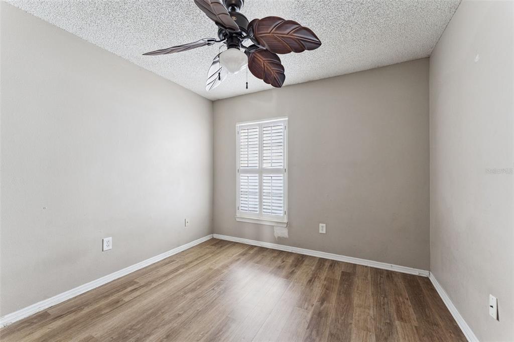 3651 North Goldenrod Road, Unit 110 Winter Park, FL 32792 - Photo 16 of 19 a view of a room with a hardwood floor and a ceiling fan