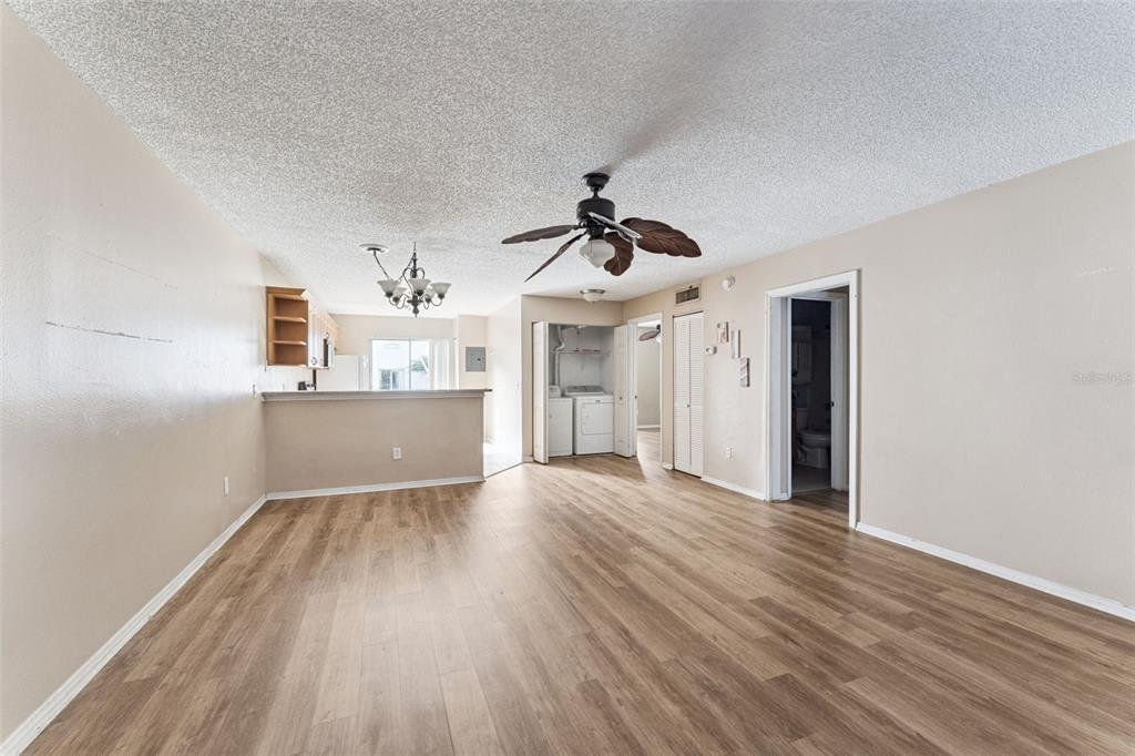 3651 North Goldenrod Road, Unit 110 Winter Park, FL 32792 - Photo 7 of 19 a view of a kitchen with wooden floor and a ceiling fan