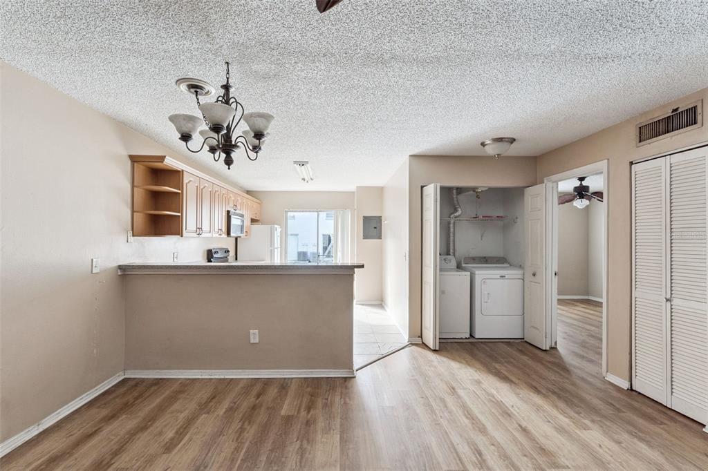 3651 North Goldenrod Road, Unit 110 Winter Park, FL 32792 - Photo 8 of 19 a view of a kitchen with a sink and refrigerator