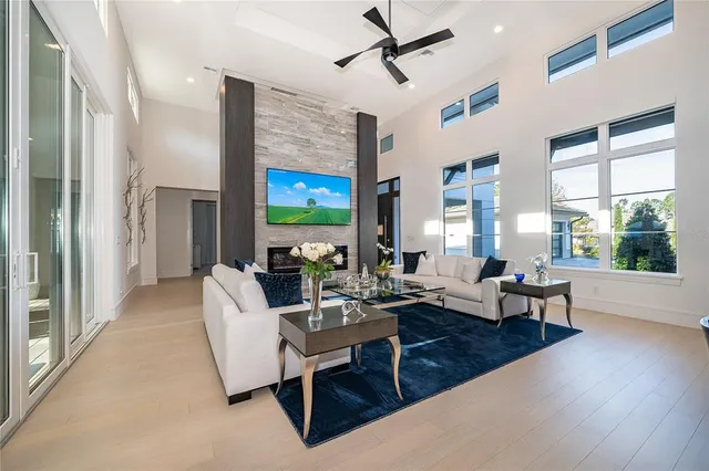 a bathroom with a sink a potted plant and a window