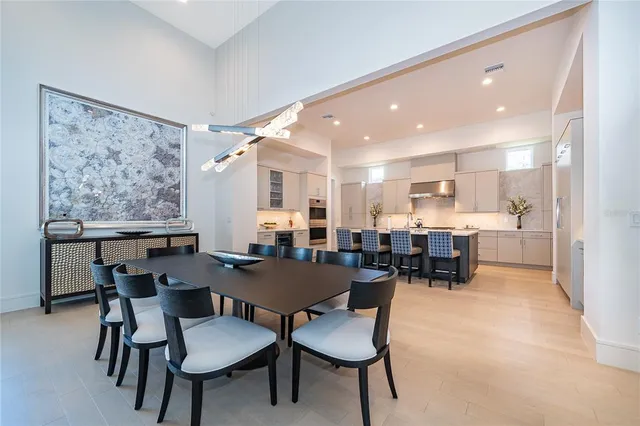 a bedroom with a large bed and a flat screen tv