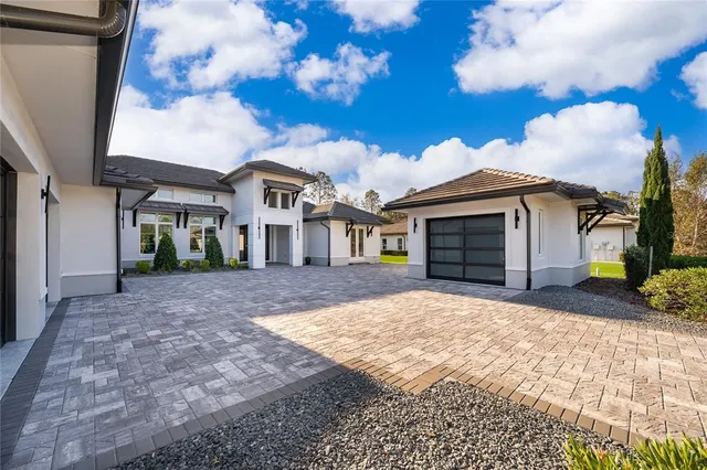 a swimming pool with outdoor seating and yard