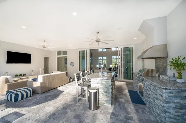 an aerial view of residential house with outdoor space and swimming pool