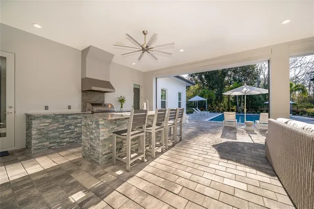 an aerial view of a residential houses with outdoor space