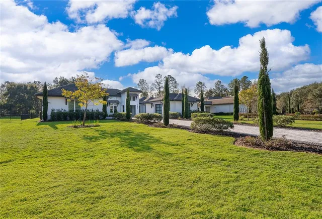 a very nice looking room with a large window and chandelier