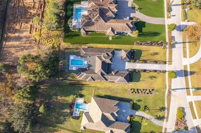 a living room with fireplace furniture and a large window