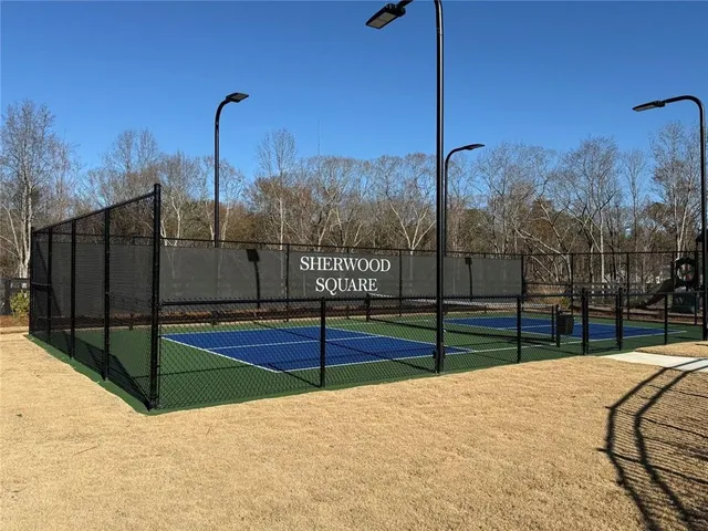 a view of outdoor space with tennis court