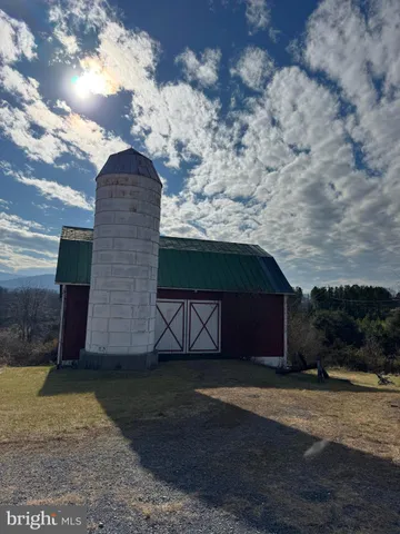 a view of a livingroom with furniture and staircase