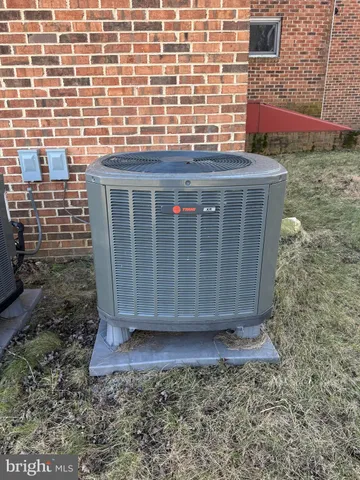 a view of an ocean & house in the background