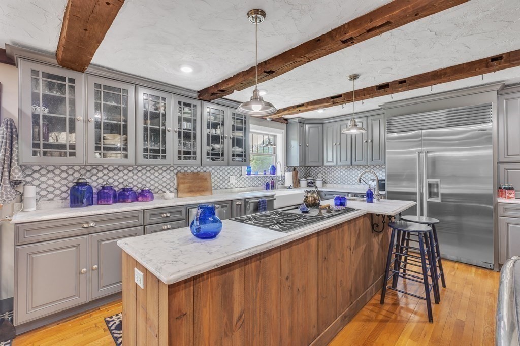 31 Washington Street Mendon, MA 01756 - Photo 12 of 40 a kitchen with a sink a stove and cabinets