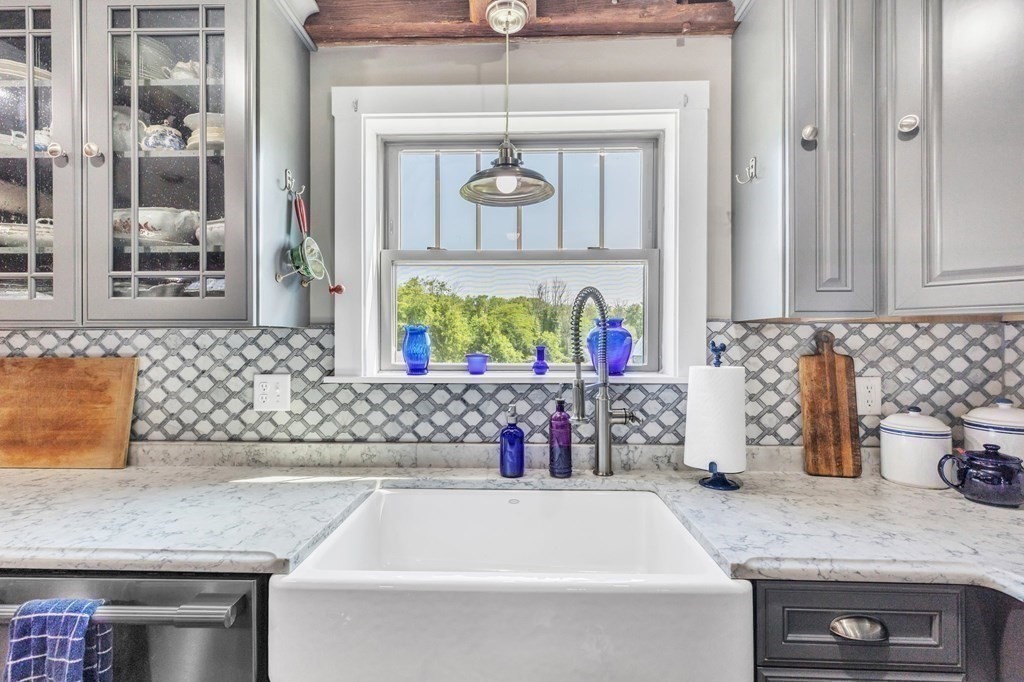31 Washington Street Mendon, MA 01756 - Photo 15 of 40 a bathroom with a granite countertop sink vanity and mirror