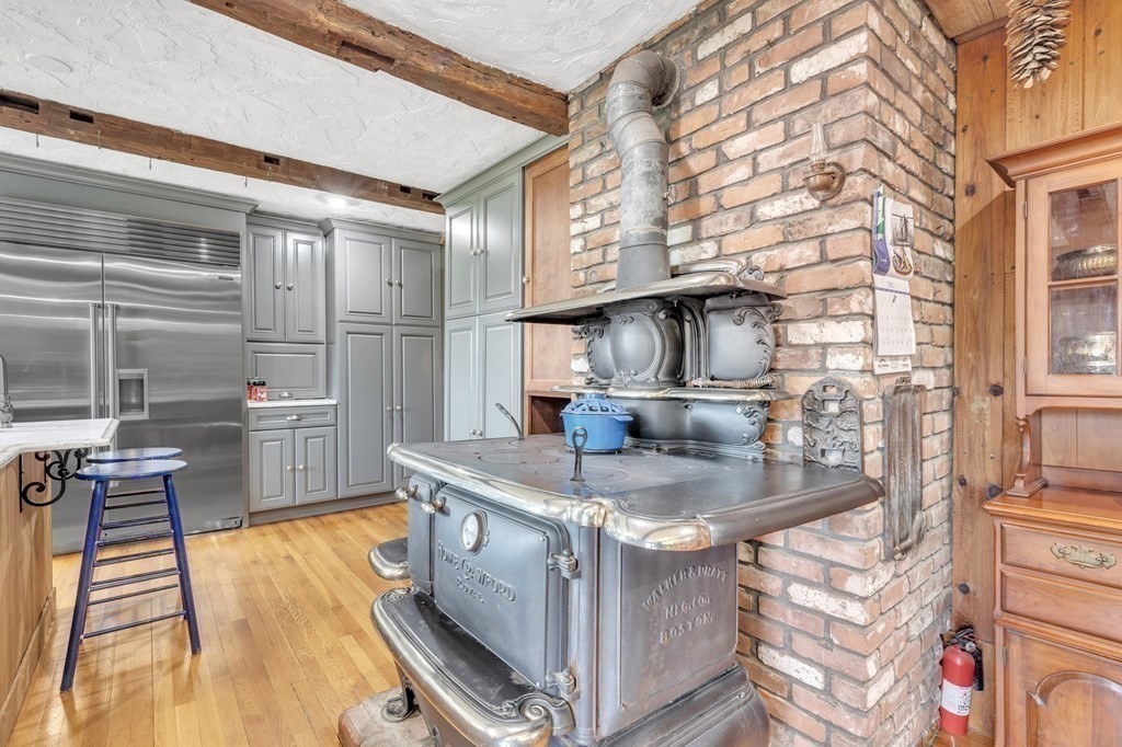 31 Washington Street Mendon, MA 01756 - Photo 16 of 40 a kitchen that has a sink and a stove