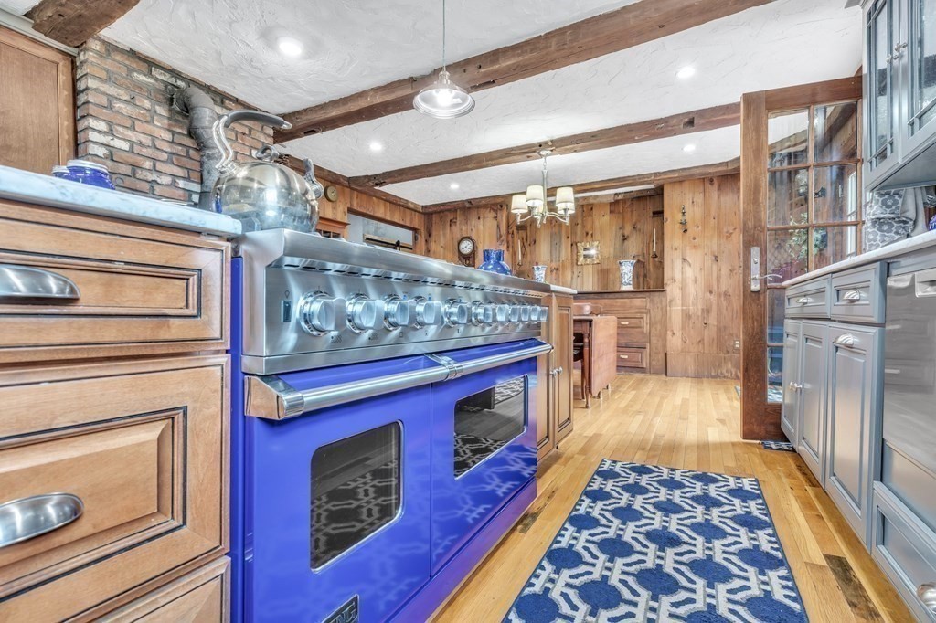 31 Washington Street Mendon, MA 01756 - Photo 18 of 40 a kitchen with stainless steel appliances granite countertop a stove and a refrigerator
