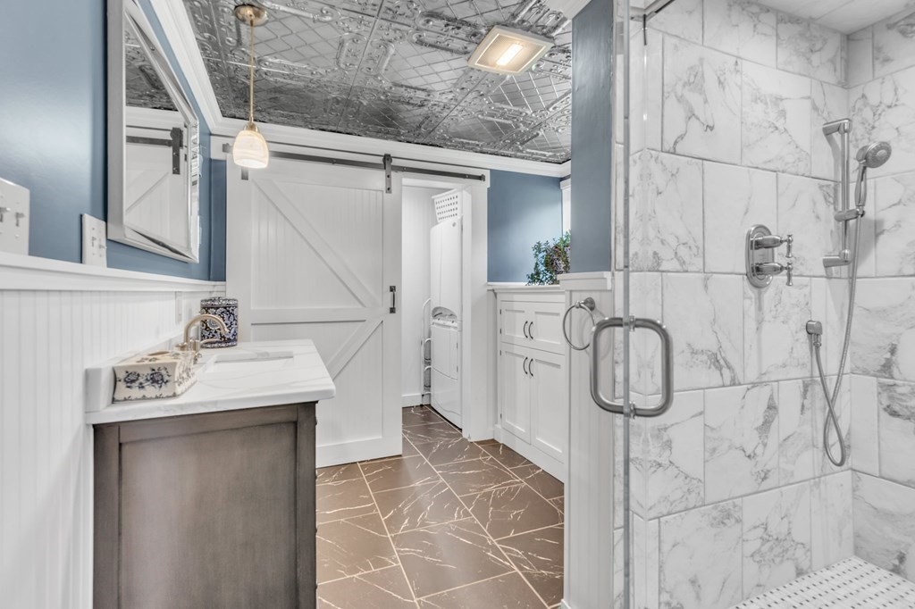 31 Washington Street Mendon, MA 01756 - Photo 23 of 40 a bathroom with a sink and mirror