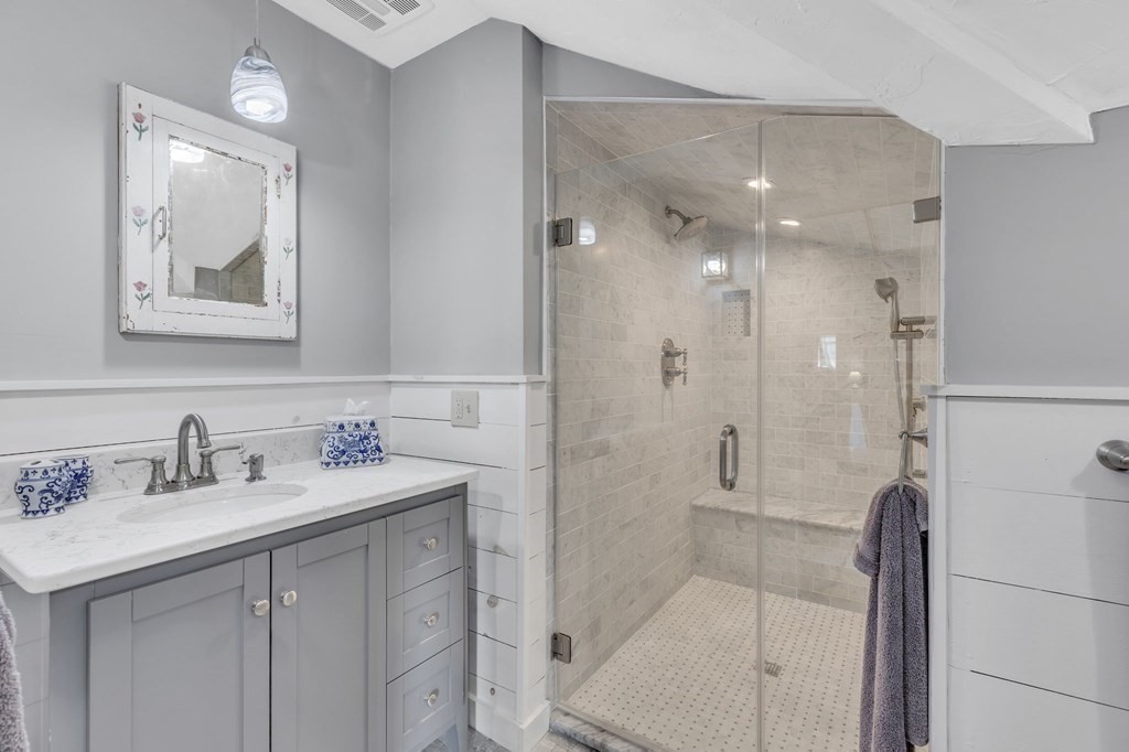 31 Washington Street Mendon, MA 01756 - Photo 28 of 40 a bathroom with a shower sink and mirror