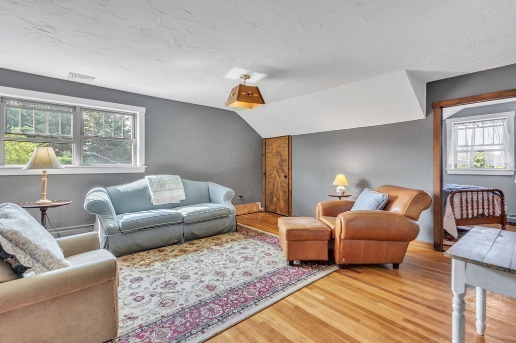 31 Washington Street Mendon, MA 01756 - Photo 29 of 40 a living room with furniture and a couch