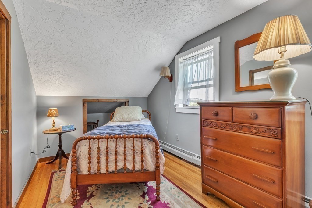 31 Washington Street Mendon, MA 01756 - Photo 30 of 40 a view of a bedroom with furniture and staircase