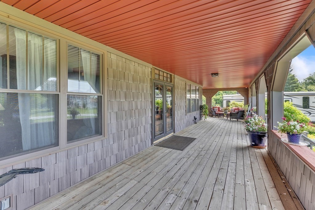 31 Washington Street Mendon, MA 01756 - Photo 3 of 40 a porch with wooden floor