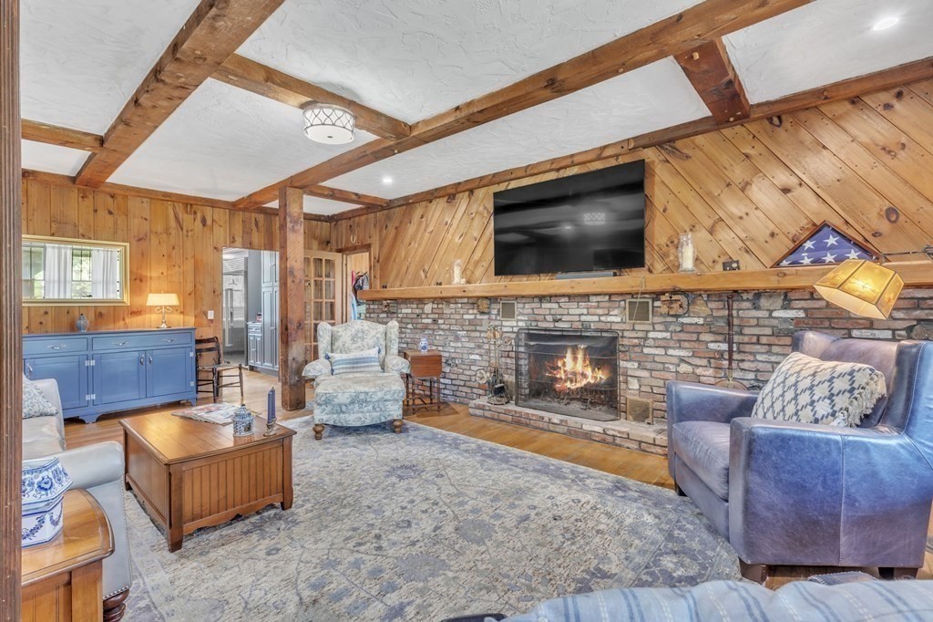 31 Washington Street Mendon, MA 01756 - Photo 6 of 40 a living room with furniture and a fireplace