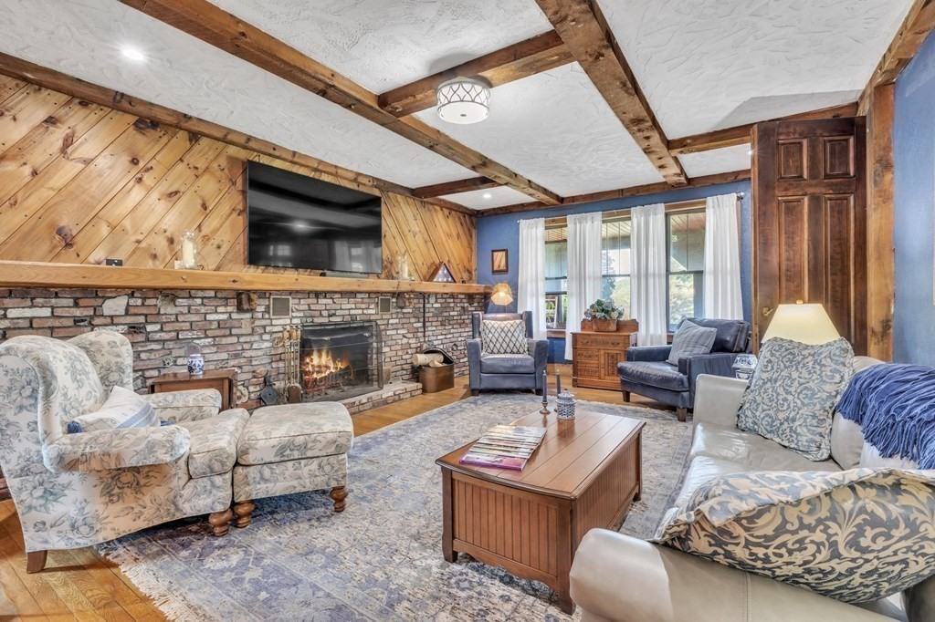 31 Washington Street Mendon, MA 01756 - Photo 7 of 40 a living room with furniture fireplace and a flat screen tv