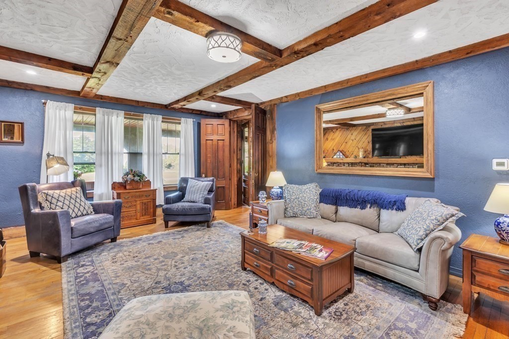31 Washington Street Mendon, MA 01756 - Photo 8 of 40 a living room with furniture and a large window
