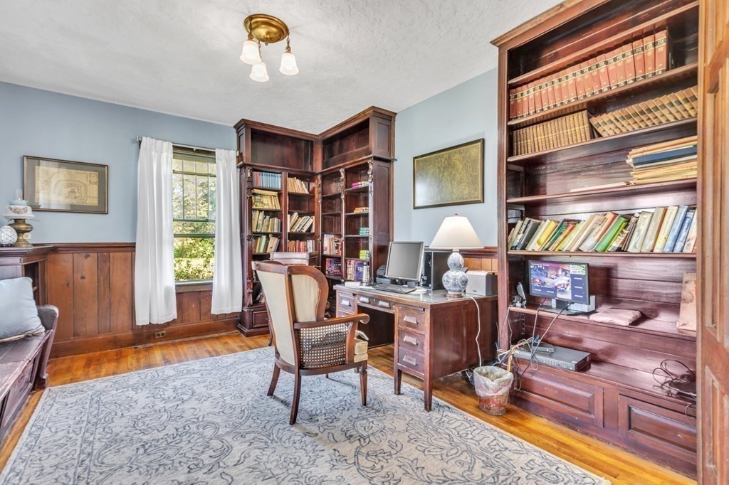 31 Washington Street Mendon, MA 01756 - Photo 10 of 40 a living room with furniture a window and bookshelf