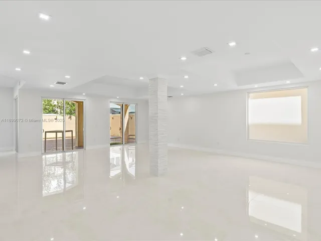 a view of an empty room and window