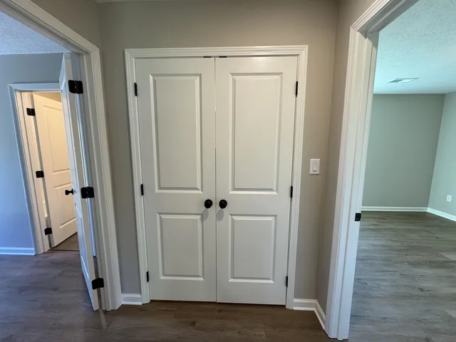 an empty room with wooden floor