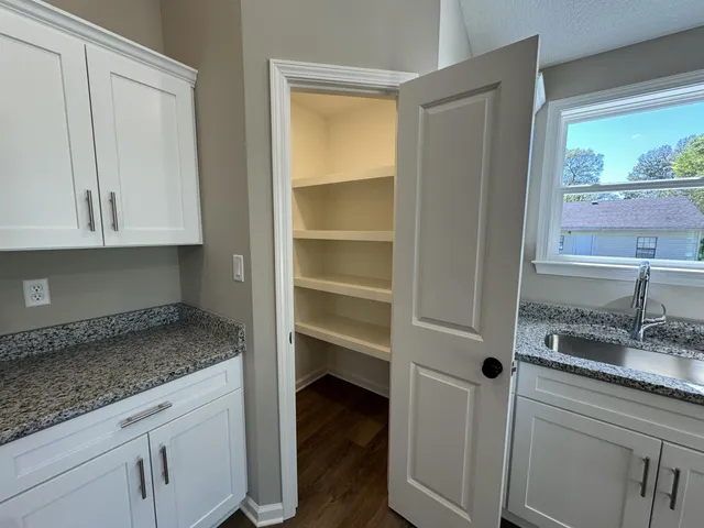 a kitchen with a sink and cabinets