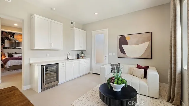 a living room with furniture a couch and a potted plant