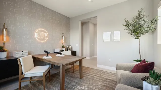 a view of a dining room with furniture and a potted plant