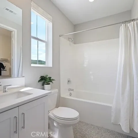 a bathroom with a sink a toilet and a bathtub
