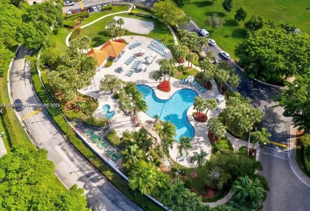 a kitchen with a stove a refrigerator and a sink