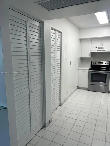 a view of an empty room with a sliding door