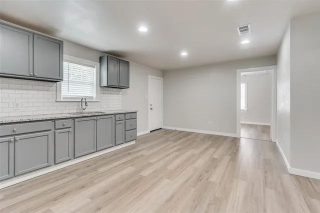 a view of a kitchen counter space and a sink