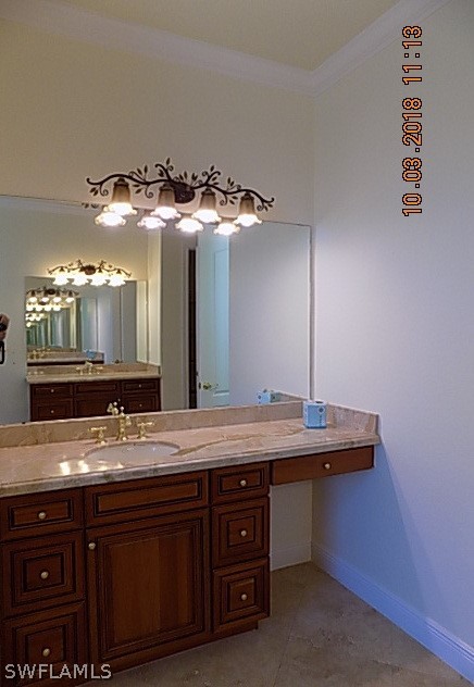 19220 La Serena Drive Estero, FL 33967 - Photo 15 of 27 a bathroom with a granite countertop sink and a mirror