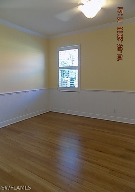 19220 La Serena Drive Estero, FL 33967 - Photo 20 of 27 an empty room with wooden floor and windows