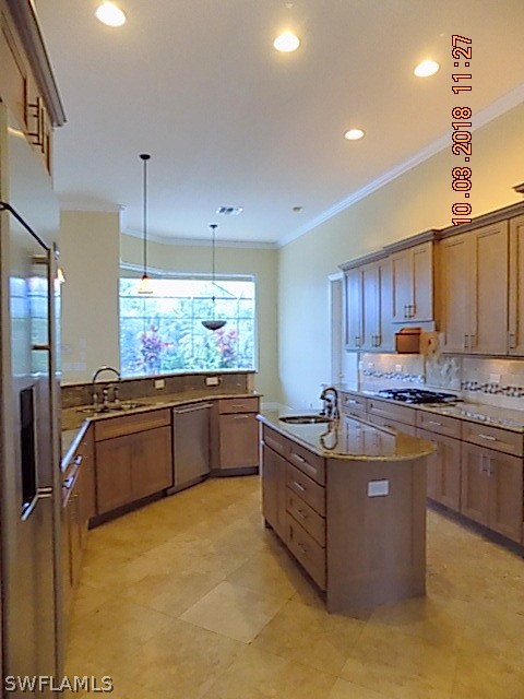 19220 La Serena Drive Estero, FL 33967 - Photo 27 of 27 a kitchen with stainless steel appliances granite countertop a stove and a refrigerator