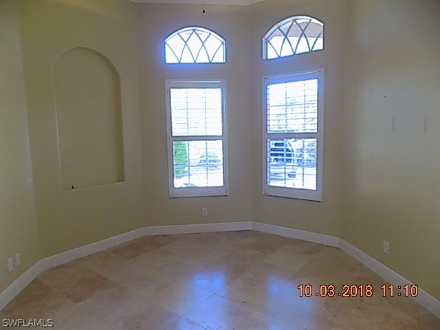 19220 La Serena Drive Estero, FL 33967 - Photo 8 of 27 an empty room with a window